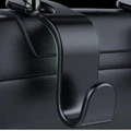 1. The original car version fits perfectly Original car data is used to open the mold and the pattern fits accurately to protect your car more comprehensively. 2.ABS material, thick and durable ABS material is durable, thickened design is anti-aging and can withstand a weight of 20 kg 3. Easy to install, convenient and fast Open the glove box and snap it in directly. It is convenient and quick to install. It will not damage the car. 4. Rotate and hide without taking up space When not in use, the hook can be rotated and hidden under the headrest without taking up space.